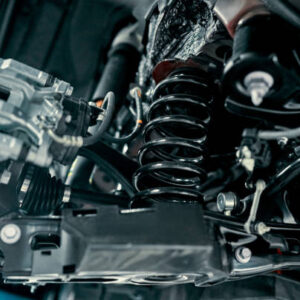 Rear suspension of a modern car. Elements and design of the rear suspension. Rear suspension beam, spring, shock absorber.
