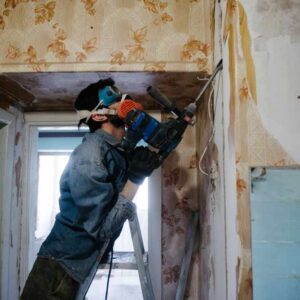A renovation worker in work