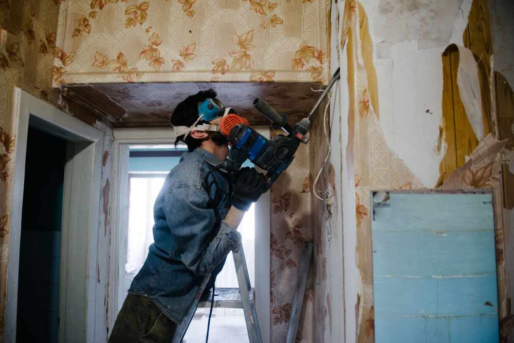 A renovation worker in work